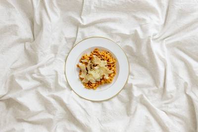 pasta dish on bed