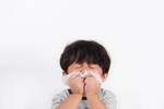 kid sneezing allergic