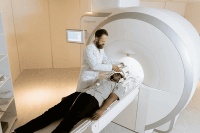 Medical professional performing CT scan on patient.