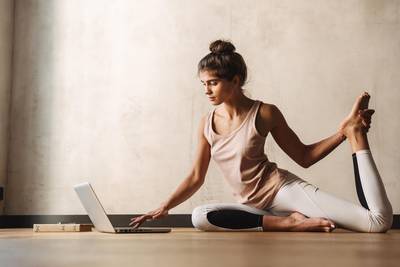 woman training posture with yoga while working