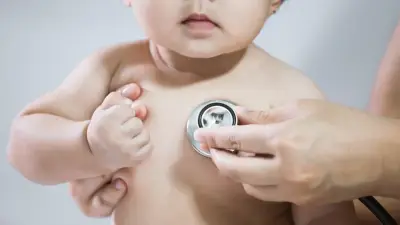 kid with stethoscope at pediatrician visit