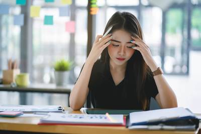 asian woman looking stressed out